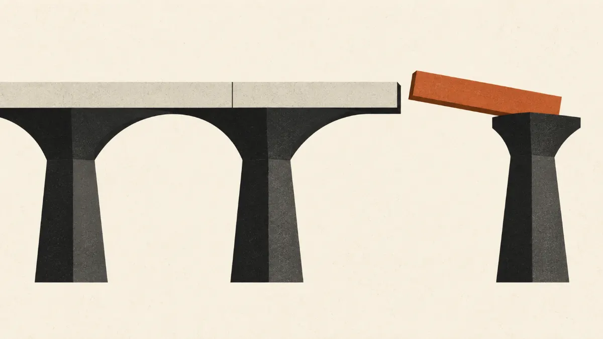 An orange beam bridging a gap between two charcoal supports